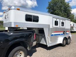 In kearney, nebraska, maintains the largest inventory of stock, horse, flatbed, dump, construction, utility and enclosed trailers in the midwest, shipping trailers from florida to alaska, new jersey to california. 2004 4 Star 14 Gooseneck Slant Load