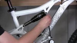 adjusting rear shock air pressure on a bicycle