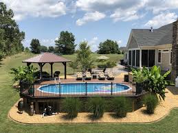 It remains popular today but has been updated with decking, fencing, stairs, and safety gates. Amazing Above Ground Pool Above Ground Pool Landscaping Backyard Pool Landscaping Best Above Ground Pool