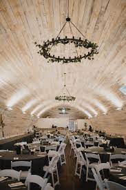 The Bowery Barn Wedding And Event Venue In Ashippun Wisconsin Shiplap Walls Modern Farmhouse Sty Low Cost Wedding Elegant Chandeliers Blue Wedding Bouquet
