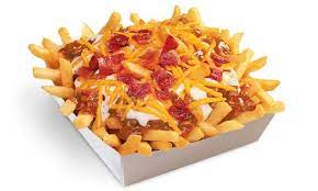 Texas chili cheese fries start with a base of golden brown french fries topped with wienerschnitzel's world famous chili sauce, chopped bacon, bbq sauce, shredded cheddar cheese and grilled onions. Bacon Ranch Chili Cheese Fries Wienerschnitzel