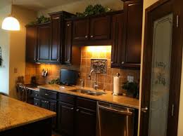 No Window Over Your Sink Use A Decorative Piece That Coordinates With Your Back Splash As A Focal Point Ra Over Kitchen Sink Lighting Kitchen Decor Kitchen