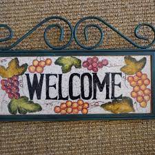 A colorfully cheerful ceramic sign welcoming munchkins to your playroom! Other Handpainted Welcome Sign Ceramic Iron Framemount Poshmark