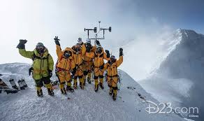 Strapped into harnesses and hanging from nylon rope, hans florine and five other performers from the vertical dance company project bandaloop twirled and soared across the face of the billboard, which was done up to look like a mountainside. National Geographic S Lost On Everest Takes Mystery To The Highest Heights D23