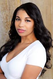 This is cast member Liz Wagner who played Ensign Lia Burke, a Registered  Nurse onboard the Enterprise. She also served as Production Assistant and  2nd Assistant Director. Behind her is Set Costumer