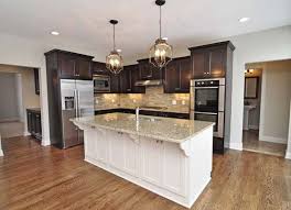 Like The Light Island And Dark Cabinets With The Light Colored Granite Popular Kitchen Colors Kitchen Colour Schemes Dark Kitchen Cabinets