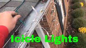 How To Hang Icicles Christmas Lights With Gutter Guards Icicle Christmas Lights Hanging Christmas Lights Christmas Lights
