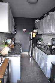 A Black And White Galley Kitchen Kitchen Spotlight Galley Kitchen Design Kitchen Remodel Small White Galley Kitchens