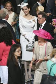 Angelina Jolie Takes A Cue From Meghan Markle In Fascinator Off The Shoulder Dress For Royal Event Angelina Jolie Red Carpet Angelina Jolie Celebrity Style Red Carpet