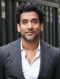 Member Of Parliament Representing Enclave 19 Naveen Andrews Mens Hairstyles Medium Mens Hairstyles Medium Hair Styles