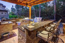 Your choices of appliances may mean adding additional electric, gas and water lines to serve your new outdoor kitchen find outdoor kitchen builders near you. The Hidden Grove Creekstone Outdoor Living