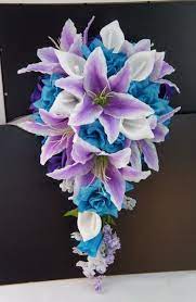 My wedding colors are purple, teal, silver. Purple Lavender Turquoise Roses With White Calla Lilies And Tiger Liliescascade Bridal Pr Teal Wedding Flowers Turquoise Wedding Flowers Purple Wedding Flowers