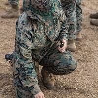 US Navy 031018-N-4055P-011 Lance Cpl. Leighton Becker talks with teammates  over the radio
