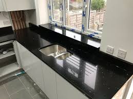 Imperial danby marble is the countertop and backsplash. Black Quartz Kitchen Worktops Novocom Top
