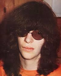 Johnny Ramone reading a book; Mystery Train, in the tour bus!