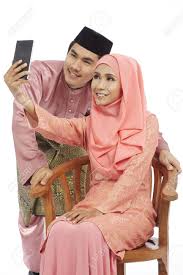 Miranda is never tired for make a cute selfie. Couple In Traditional Malay Clothes Taking Selfie With Smartphone Stock Photo Picture And Royalty Free Image Image 80135215
