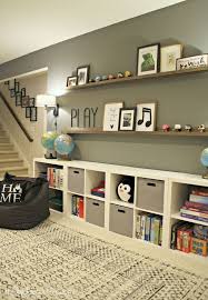 Huge Empty Wall Transformed Into Pretty Game And Toy Storage Storage Toys Ga Kinderzimmer Deco Maison Decoration Maison Idee Salle De Jeux