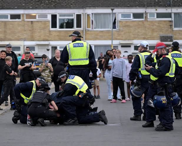 Norfolk police arrest two men after officers injured during unrest over asylum plans | UK news | The Guardian