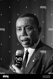 Floyd B. McKissick, national director of the Congress of Racial Equality,  talks with newsmen in Washington, May 31, 1966,