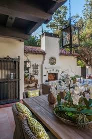 grouping of orchids with moss in rustic container from robert pattison s los feliz hou hauser im spanischen stil spanische dekorationen haus im spanischen stil