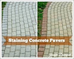 Check out this large paver patio laid out with dark shaded pavers with light gray tiles breaking the regular pattern for an interesting look. Concrete Patio Pavers Concrete Stain Ideas For An Update