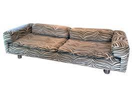 Featuring a combination of solid acacia and acacia veneers, it boasts a distinctive geometric profile with unique details like concave drawer fronts and minimalist bronze hardware. Howard Keith Diplomat Sofa Zebra Velour Fabric Vintage Film And Furniture