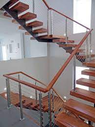 Modern Wood Stairs With A Stainless Steel Cable Railing System Designed By Agsstainless Co Stainless Steel Stair Railing Steel Stair Railing Stair Railing Kits