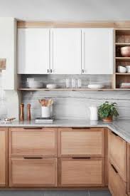 Introduce a subtle, natural touch of grey with graphite kitchen cabinets featuring visible woodgrain. Clare Innes Vtclare Profile Pinterest