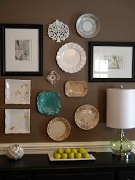 Here on how to decorate, it's her goal to help you turn your home into your. Plate Wall Decoration Of Different Shapes And Styles On Brown Dining Room Wall Plate Wall Decor Plates On Wall Plate Wall Dining Room