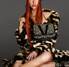 The italian fashion brand shows the 'levitate' singer as a redheaded stunner in studio P88srqjz4pvsbm