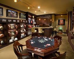 But there's nothing wrong with setting up a space for getting on your treadmill or weightlifting, being active, rocking out to music. Memorabilia Is Displayed In Custom Designed Cabinetry With Zenon Lighting Magnetic Acrylic Panels At The Top Of T Man Cave Design Man Cave Room Best Man Caves