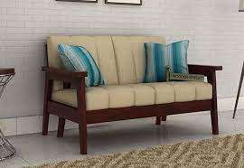 For Those Who Prefer To Keep The Living Area Really Simple The Skyler 2 Seater Wooden Sofa With Mahogany Finish Can Wooden Sofa Designs Wooden Sofa Sofa Decor