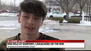 Man held at gun point, carjackers