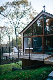 American Firm Lang Architecture Has Designed And Developed A Collection Of Light Filled Vacation Cabins In U House In The Woods Modern Cabin Architecture House