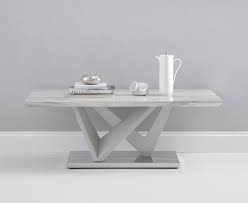 This table is best for smaller living rooms because of its round shape. Reims Marble Effect Carrera Light Grey Coffee Table