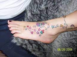 The bright colors really make the heart a stunning design. 84 Cute Star Tattoo On Foot