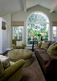 Light Grey Walls Chocolate Brown Sofa Sage Green Accent Color And Large Windows Brown Living Room Living Room Green Paint Colors For Living Room