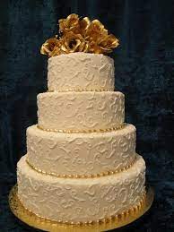 Custom Four Tier White And Gold Wedding Cake Swirl Design With Gold Beading And Flowers Gold Wedding Cake Cake Wedding Cakes