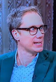 Eyes still bulging with imagined riches