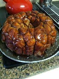 Spray a bundt pan generously with cooking spray and then pour the mixture into the pan. Easy Monkey Bread 4 Cans Of Pillsbury Biscuits 1 2 Cup Of Melted Butter 3 4 Cup Of Packed Brown Suga Easy Monkey Bread Monkey Bread Recipes Pillsbury Biscuits