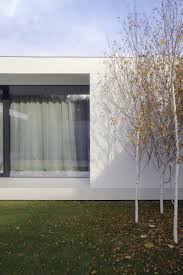 A Single Story Pavilion Of Glass Concrete And Wood Located In The Suburbs Of Chisinau Flat Plot Of A Trapez House Architecture Design Architecture Architect