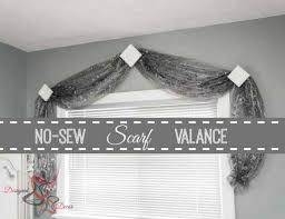 For a little extra pizazz, accent the corners of the swags with rosettes. No Sew Scarf Valance Designed Decor