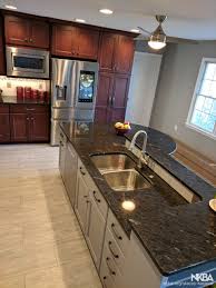 There are several choices of design in regards to islands or, even if the budget allows, they are custom designed. Cherry Gray Kitchen Two Tiered Island With Seating Nkba