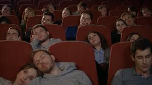 These are some of the best movies worth to watch when you're bored. People Watch Boring Movie At Cinema In Slow Motion Group Of Young People Sleeping Watching Boring Movie In Cinema Bored Audience Watching Film In Cinema Spectators Fall Asleep From Boring Film Stock