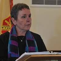 Retired Command Sgt. Maj. Jesse James stands with wife