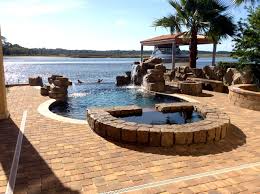 Drone shot of our ricorock tennessee ledger faux rock waterfall with our 9″ coping. Ricorock Swimming Pool Waterfall Rustikal Pools Jacksonville Von Ricorock Houzz