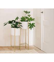 Maybe you would like to learn more about one of these? Cache Pot Sur Pied En Metal Dore Et Pot Blanc H66cm Or Maisons Du Monde