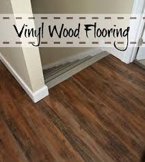 Vinyl Wood Flooring Not A Bad Option For A Cheap Quick Fix If The Hardwood Under The Carpet Is In Bad Shape House Flooring Vinyl Wood Flooring Home Renovation