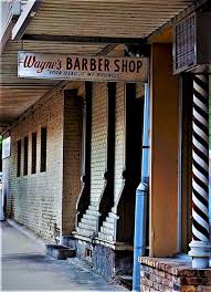 Taken in the early 1990s in downtown McKinney, just around the corner from  today's Celt Irish Pub, at Louisiana and Tennessee. Wayne's closed, I  believe, in 1999.