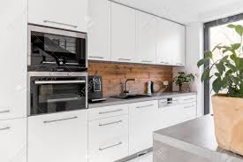 Check spelling or type a new query. Balanced Kitchen With White Cabinets Grey Worktop And Natural Accents Stock Photo Picture And Royalty Free Image Image 81873699